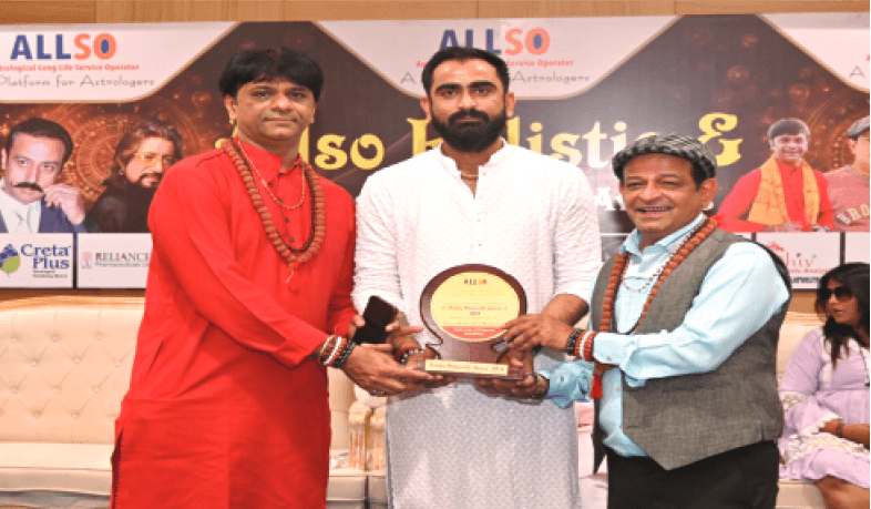 Kamlesh Pandya receiving an award