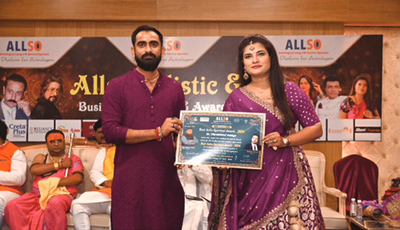 Kamlesh Pandya receiving an award